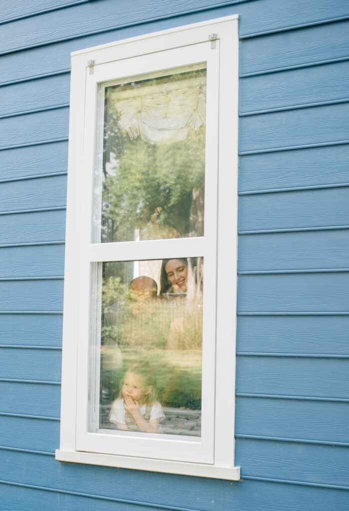 A girl looks out the window.