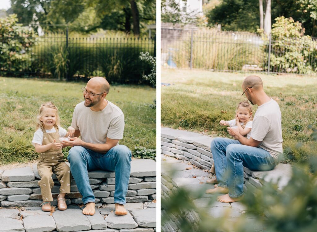 A dad and daughter share ice cream.