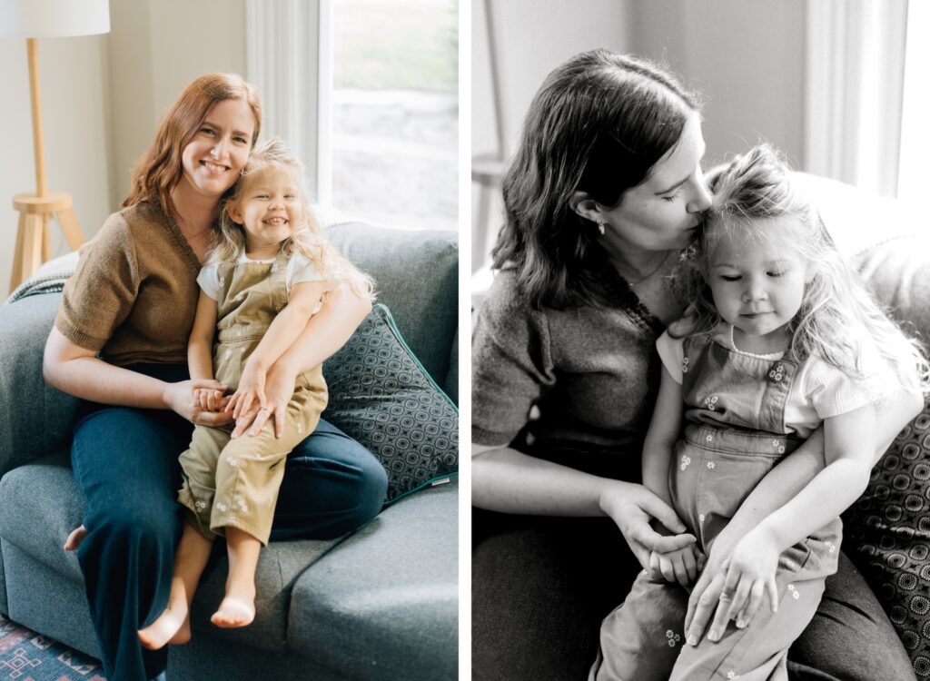A mom holding her toddler daughter and snuggling up with her.